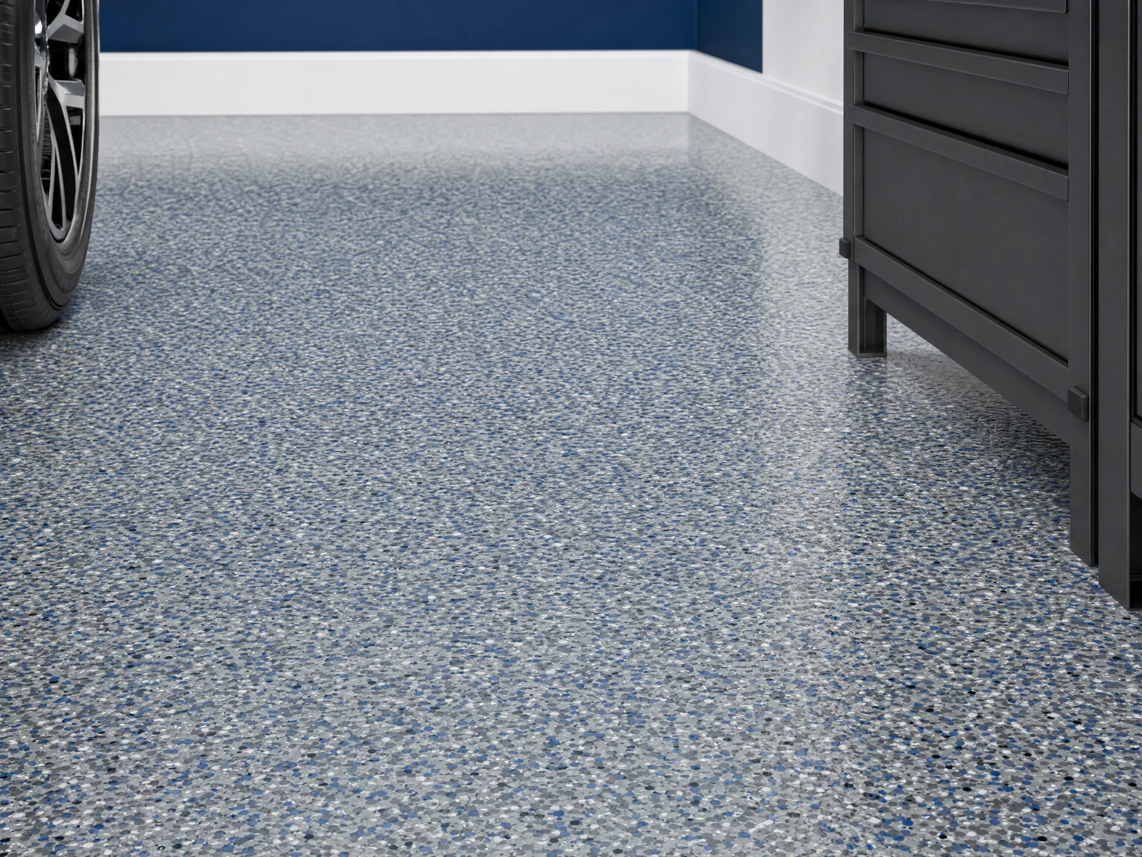 Detailed view of a gray and blue decorative flake garage floor coating